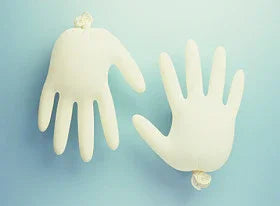 Two inflated latex gloves on a blue background, allergy and sensitive skin concept