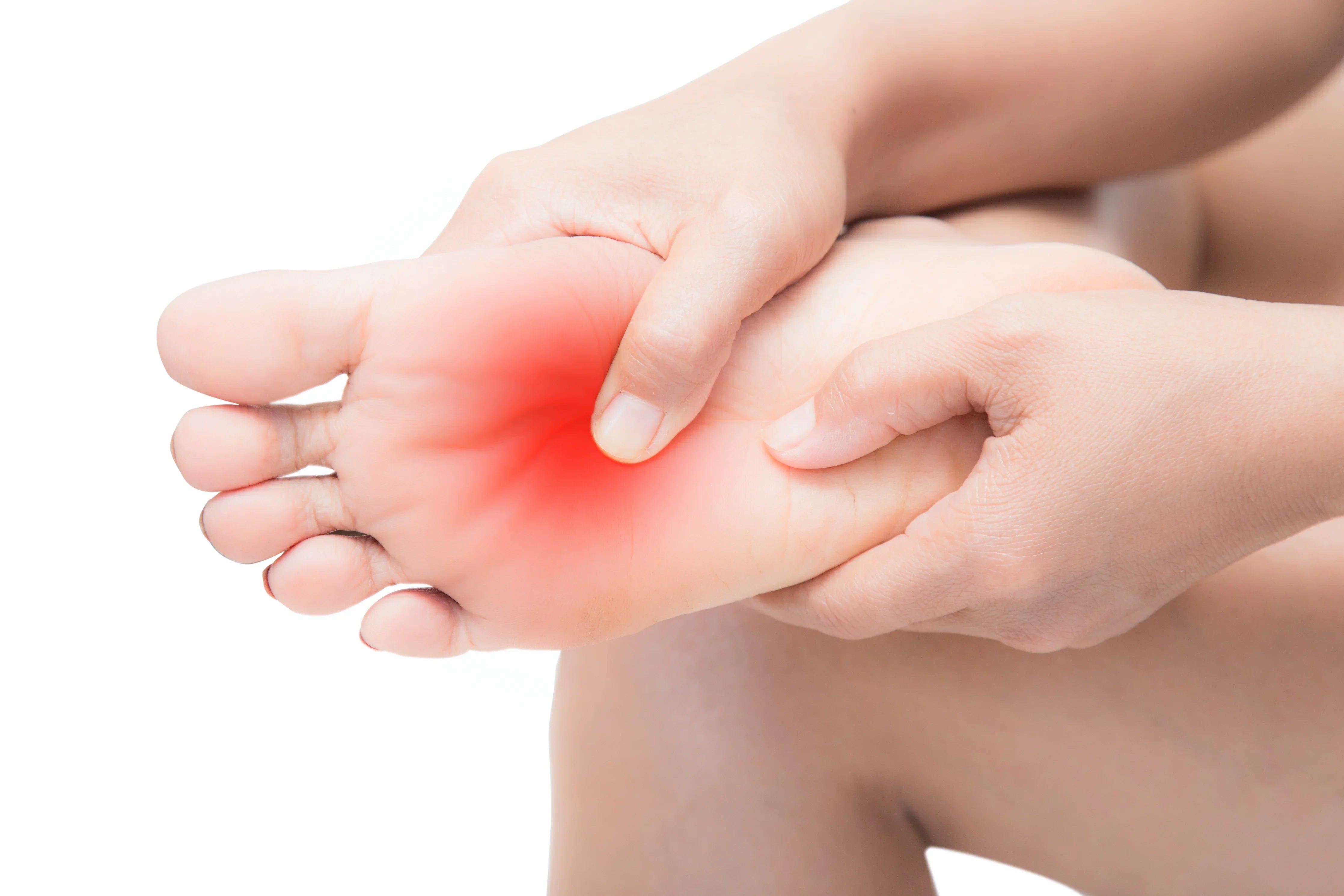 Person massaging sore foot with redness, showing skin irritation or sensitive skin pain