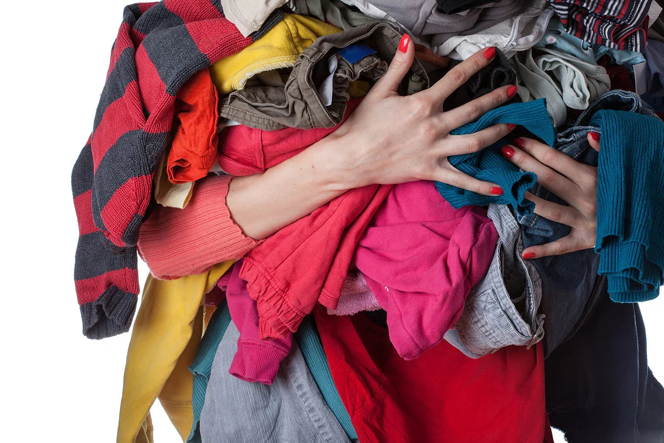 Person holding large pile of colorful cotton clothing, allergy-free apparel concept