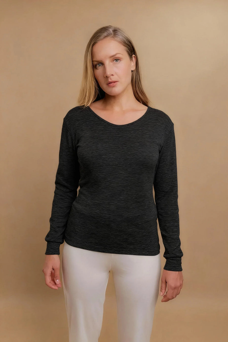 Woman wearing a long sleeve dark gray organic cotton shirt for sensitive skin