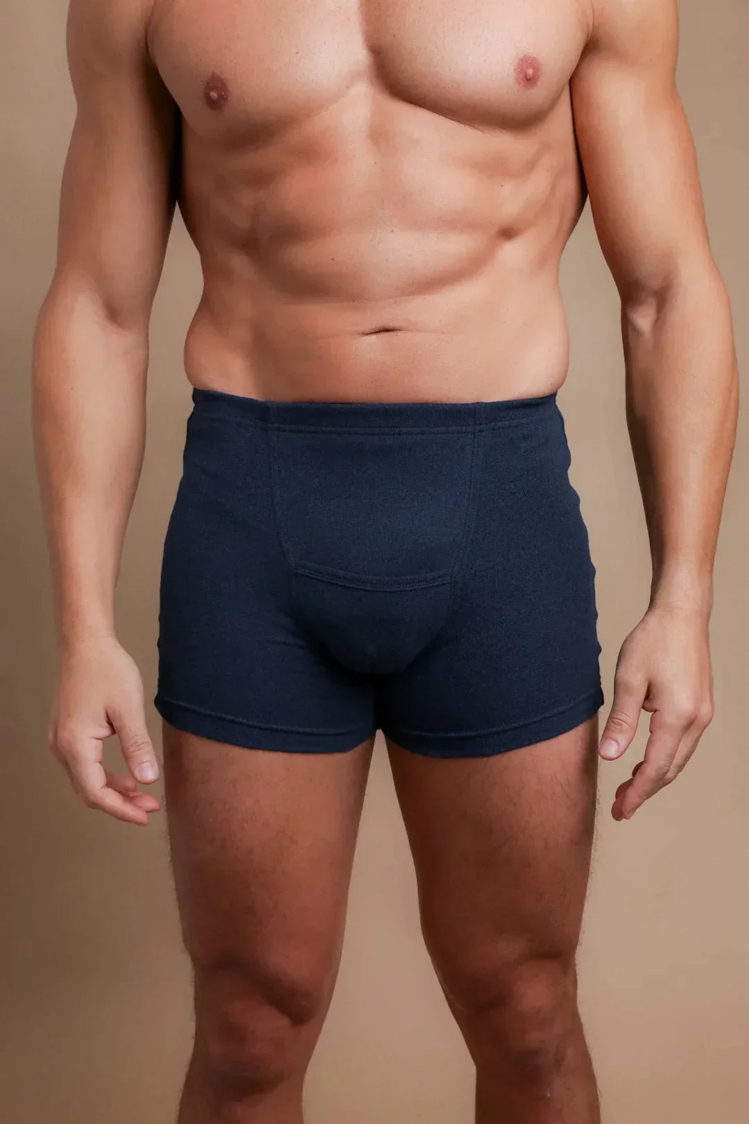 Men’s dark blue organic cotton boxer briefs for sensitive skin, shown on model
