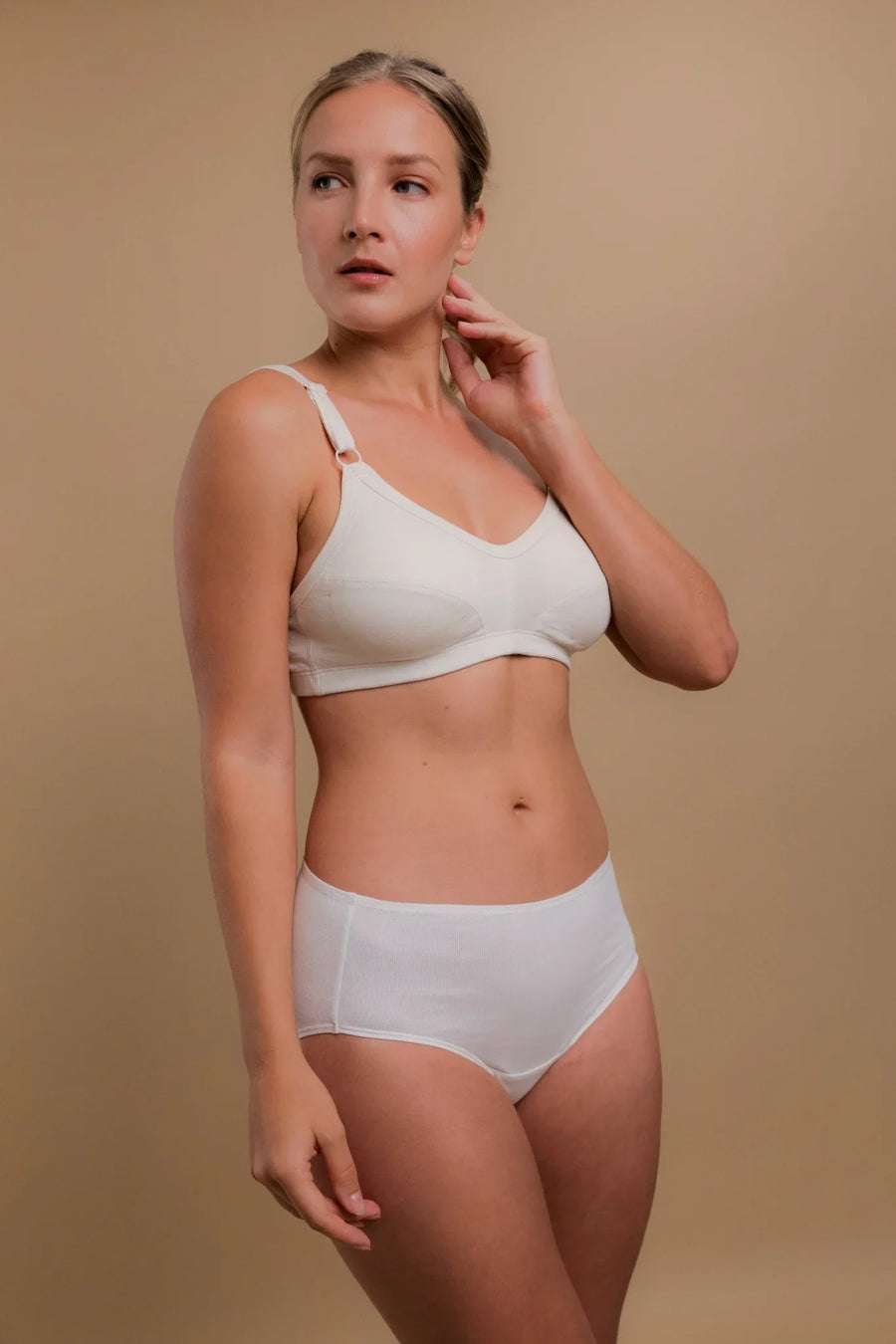 Woman wearing allergy-friendly organic cotton bra and briefs for sensitive skin