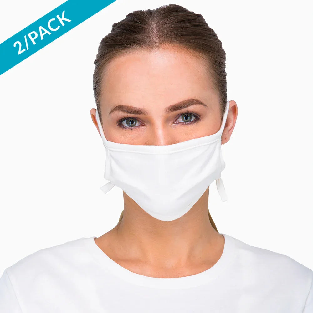 Woman wearing a white Cottonique hypoallergenic cotton face mask, 2-pack option, allergy-free apparel